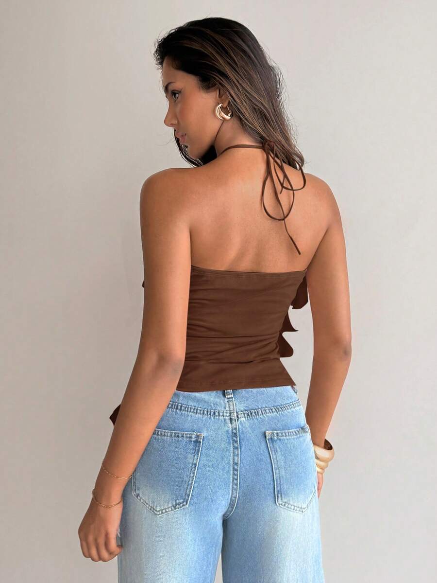 Women's sleeveless halter neck top featuring tiered ruffle layers, a backless cut, and an asymmetrical hem.
