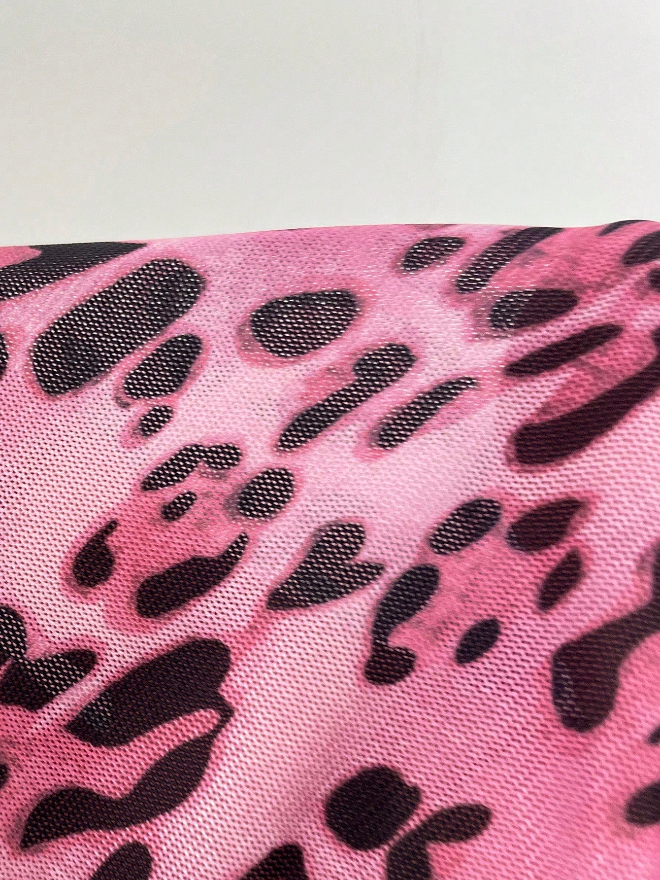 Women's pink leopard print crop camisole with spaghetti straps paired with a black lace spaghetti strap bra in a 2-piece set