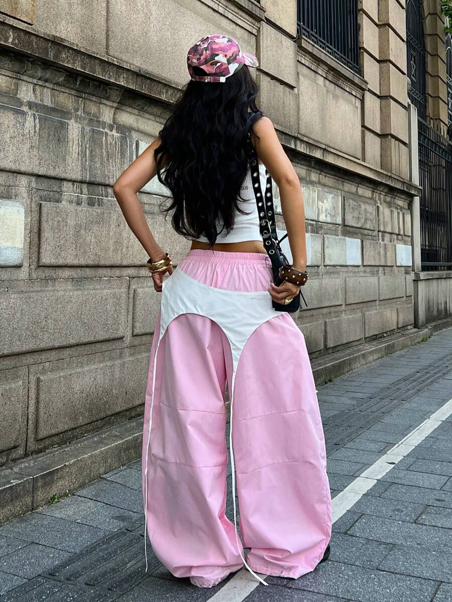 Women's casual wide leg long pants featuring an elastic drawstring waistband and loose fit silhouette.