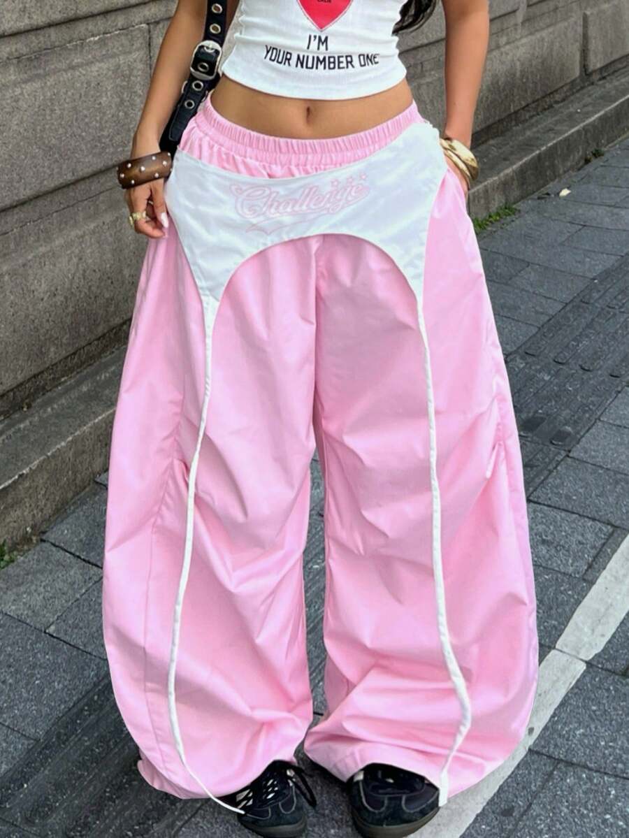 Women's casual wide leg long pants featuring an elastic drawstring waistband and loose fit silhouette.