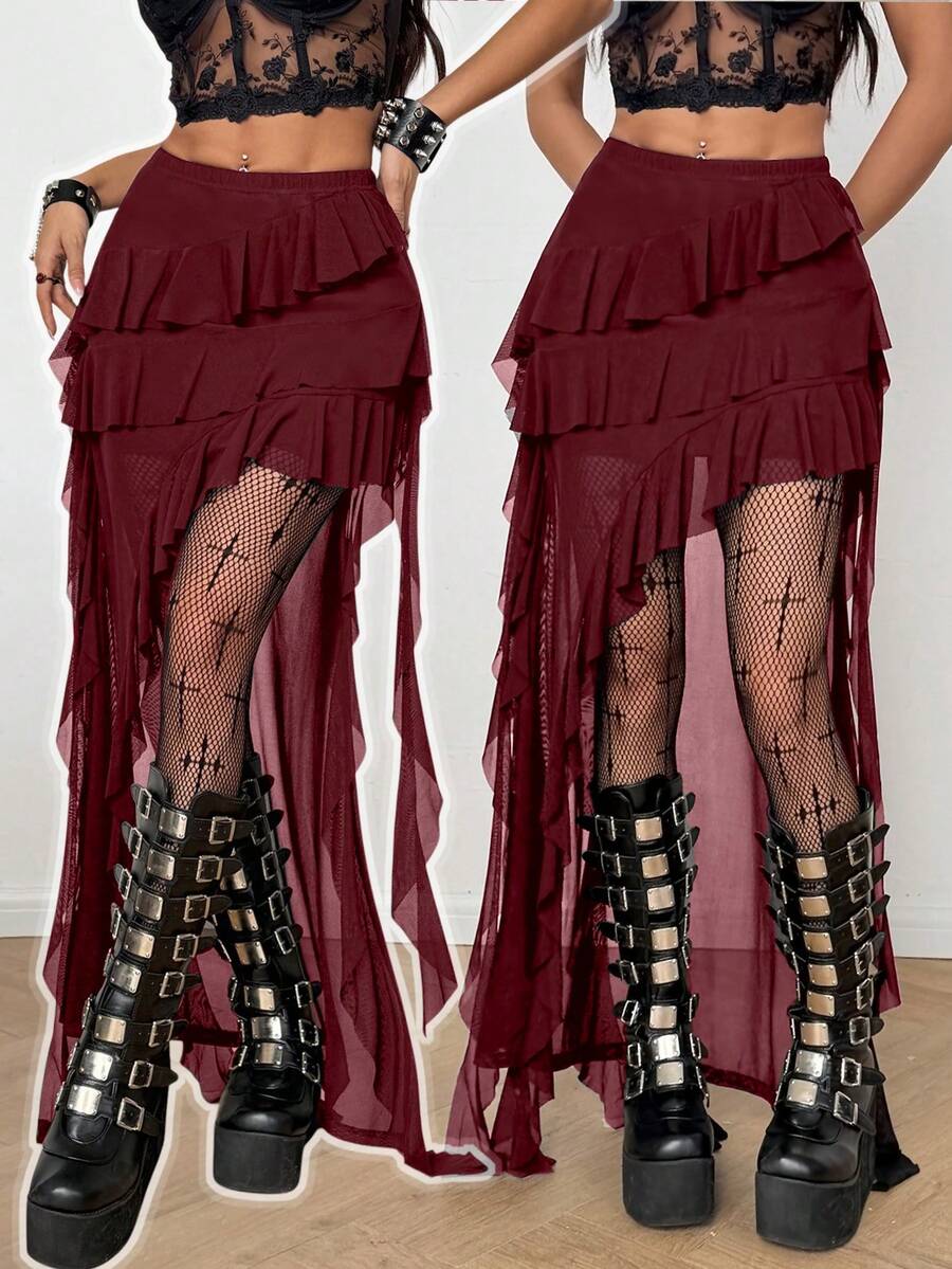 Women's low rise asymmetrical long skirt with ruffle hem detailing in semi-sheer knitted fabric.