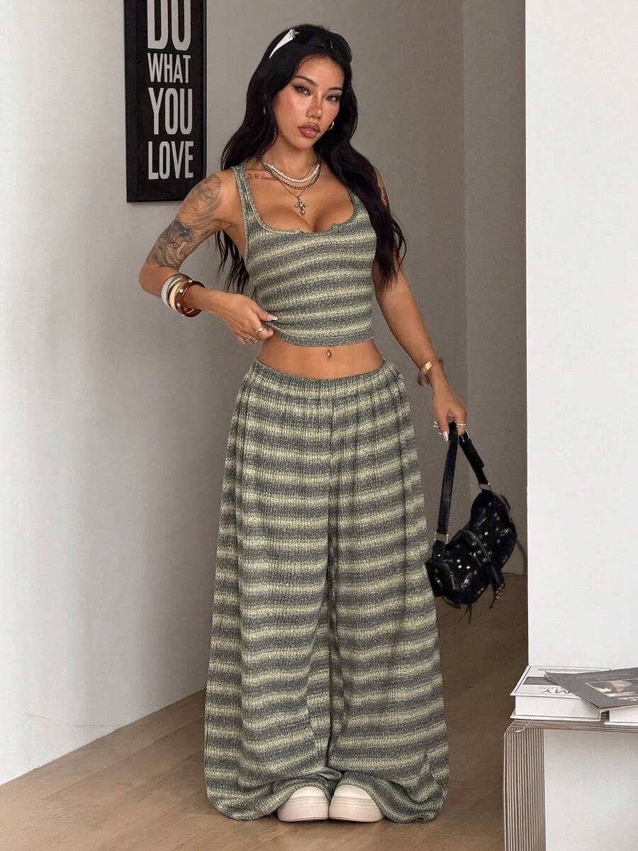Women's two-piece casual outfit featuring a slim-fit camisole tank top with ruffle trim and button front paired with high-waisted wide leg pants.