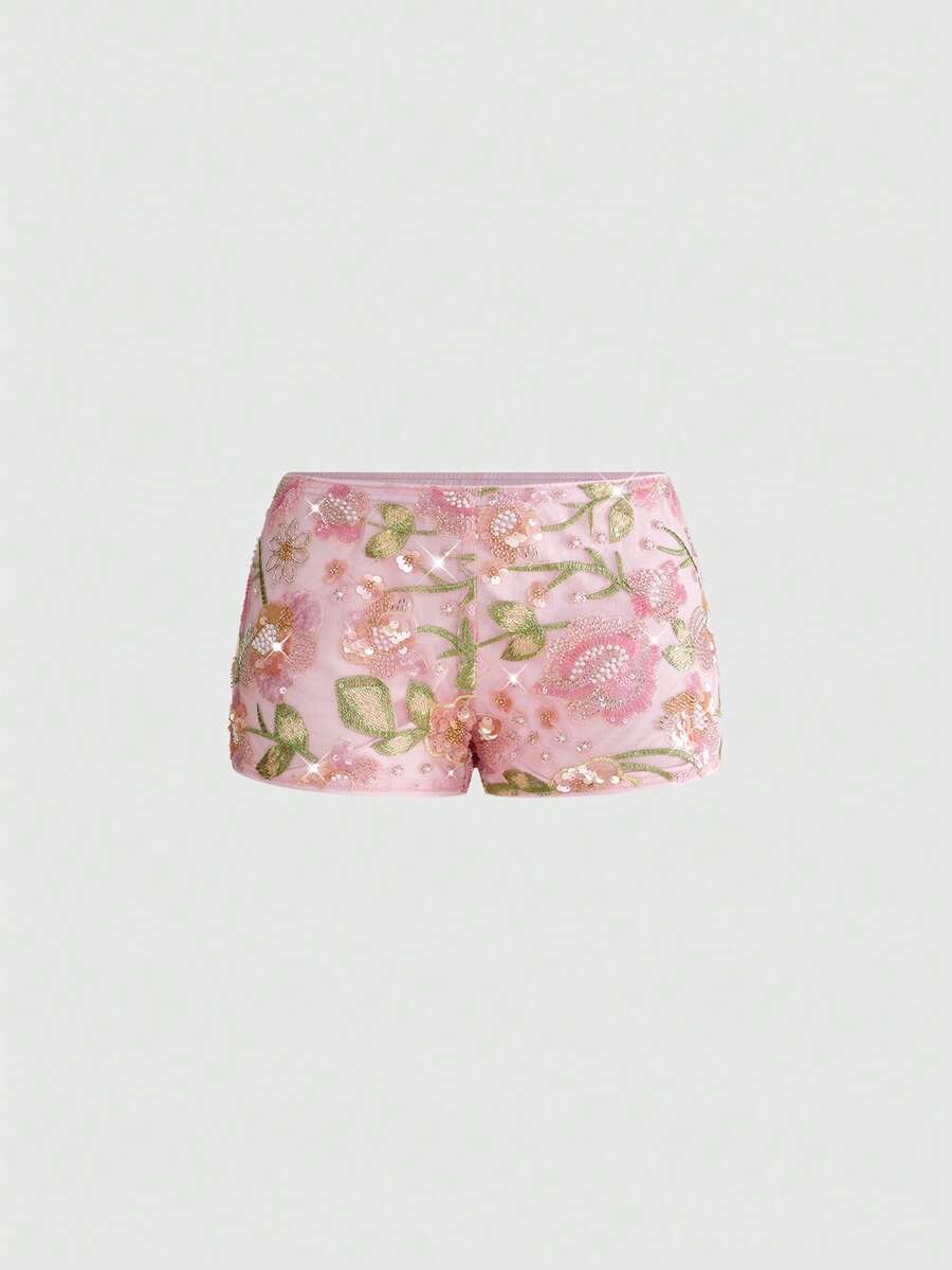 Women's ultra low waist shiny sequin mini shorts featuring a zipper fly, button closure, and high-stretch lined fabric for festival and night out outfits.