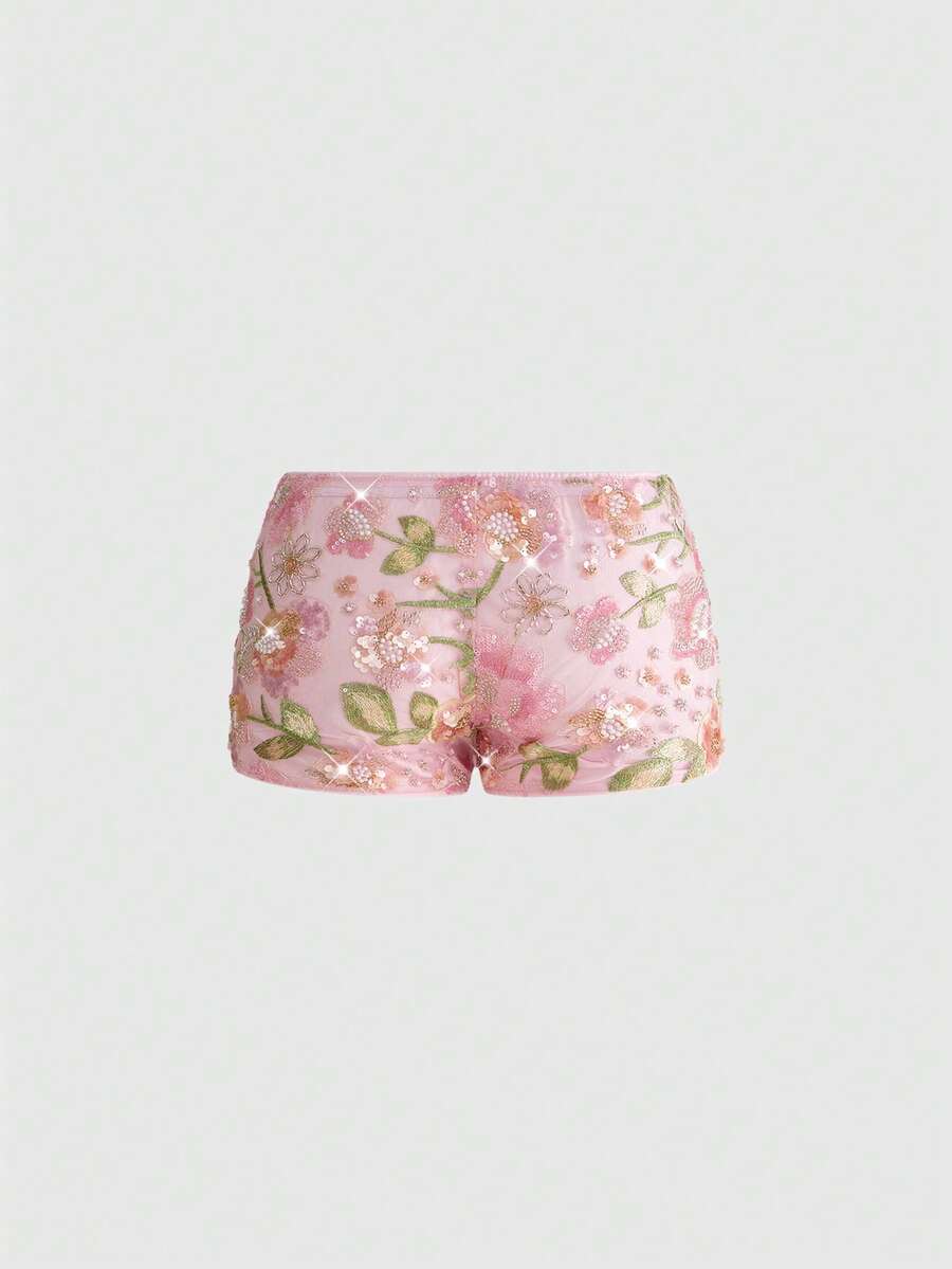 Women's ultra low waist shiny sequin mini shorts featuring a zipper fly, button closure, and high-stretch lined fabric for festival and night out outfits.
