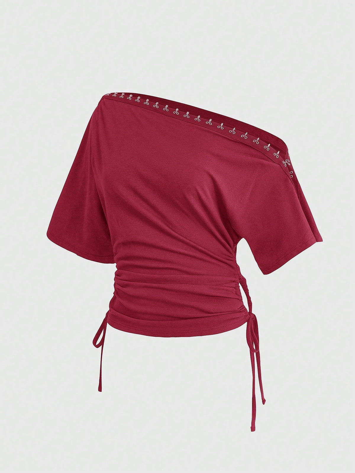 Women's slim fit short sleeve t-shirt featuring an asymmetric off-the-shoulder neckline, ruched design, and metal buckle detail.