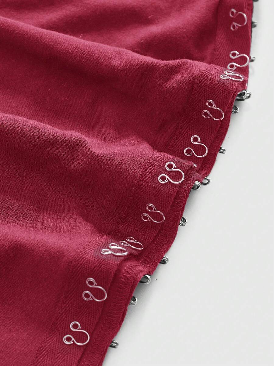 Women's slim fit short sleeve t-shirt featuring an asymmetric off-the-shoulder neckline, ruched design, and metal buckle detail.