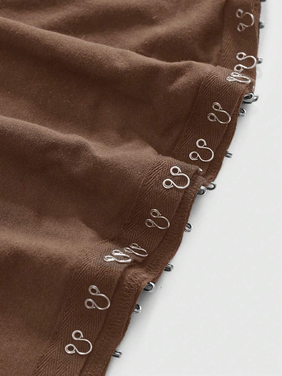 Women's slim fit short sleeve t-shirt featuring an asymmetric off-the-shoulder neckline, ruched design, and metal buckle detail.