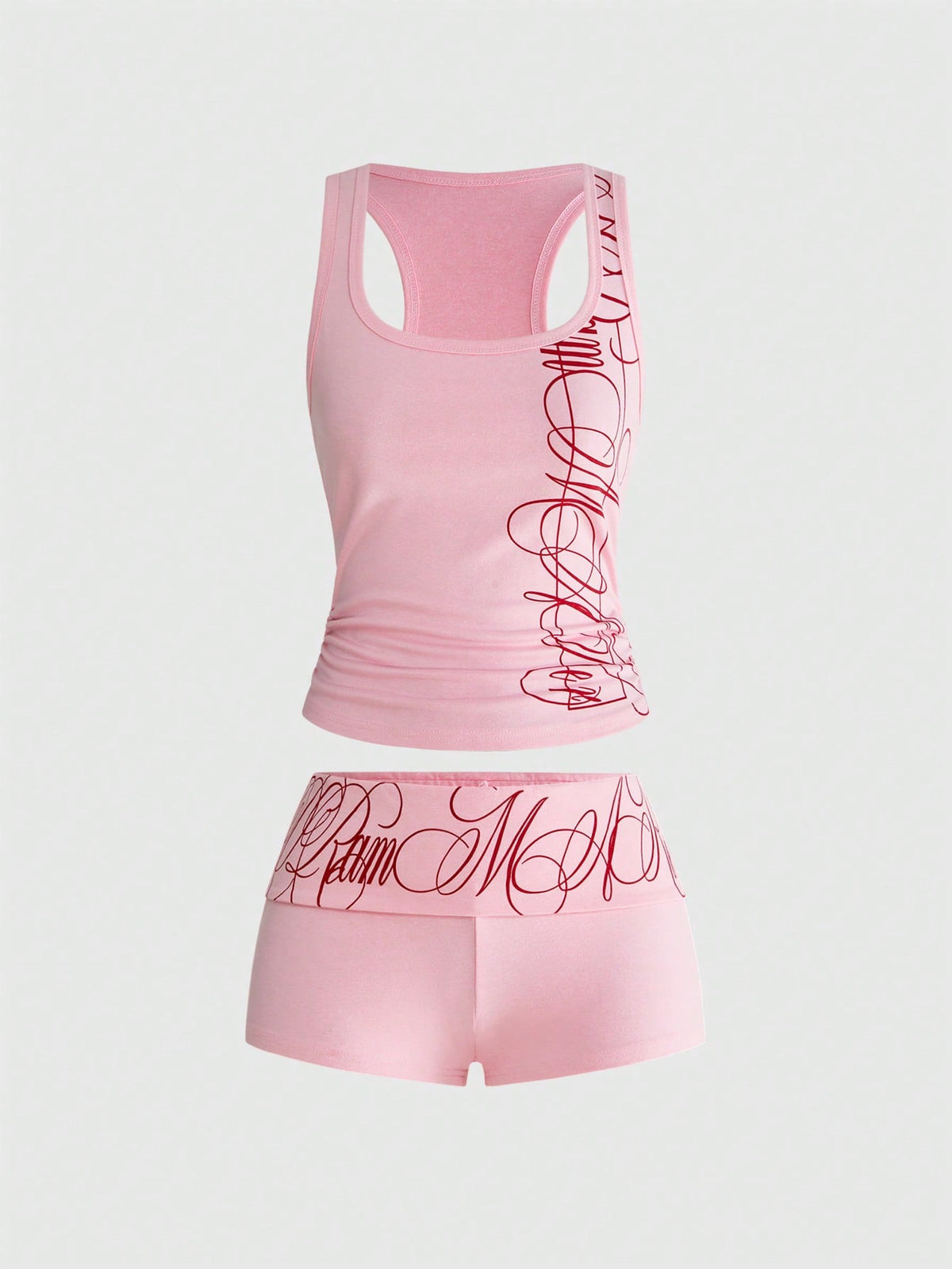 Punk-inspired two-piece set with a fitted scoop neck slogan tank top featuring cross and rhinestone details paired with ultra low waist mini shorts.