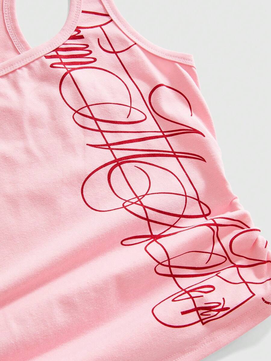 Punk-inspired two-piece set with a fitted scoop neck slogan tank top featuring cross and rhinestone details paired with ultra low waist mini shorts.