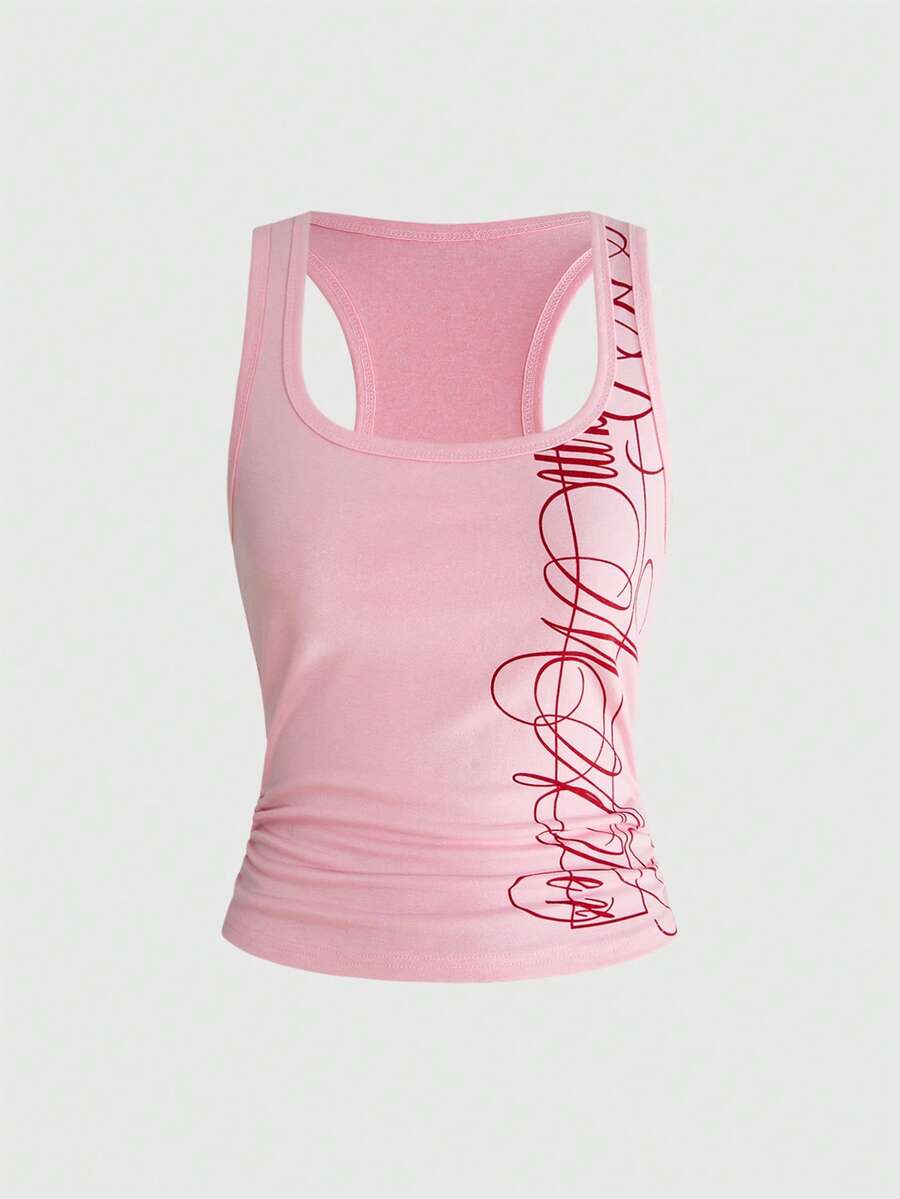 Punk-inspired two-piece set with a fitted scoop neck slogan tank top featuring cross and rhinestone details paired with ultra low waist mini shorts.