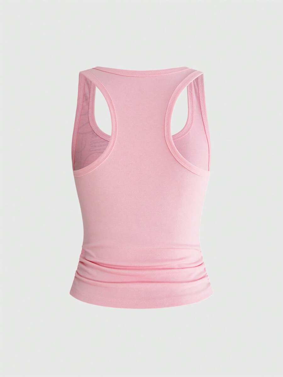 Punk-inspired two-piece set with a fitted scoop neck slogan tank top featuring cross and rhinestone details paired with ultra low waist mini shorts.
