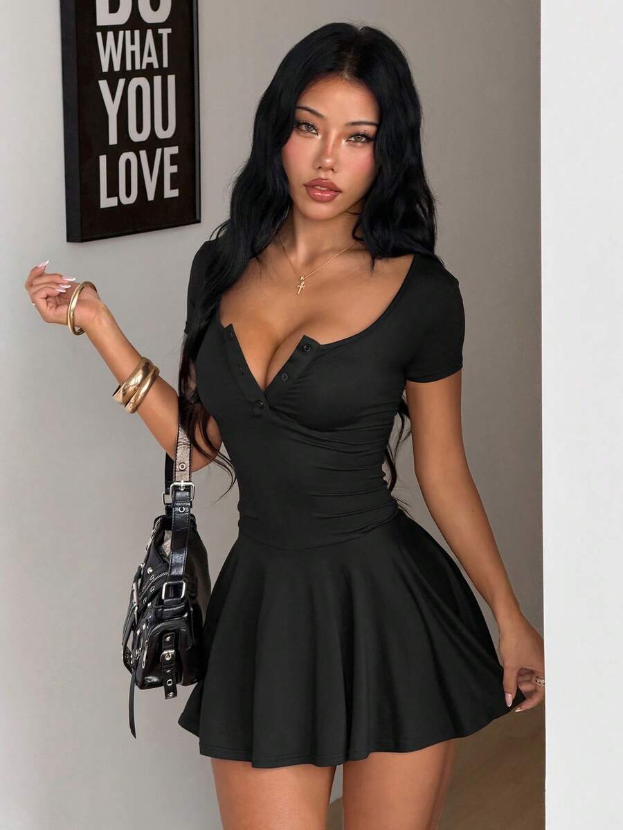 Women's slim fit knitted mini dress with scoop neckline, short sleeves, and flared A-line hem.