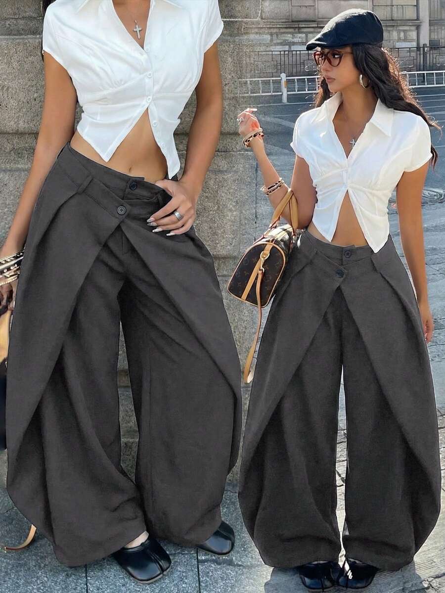 Women's loose fit pleated wide leg pants in royal blue pinstripe woven fabric with zipper fly closure.