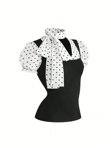 Women's black short puff sleeve graphic print t-shirt featuring a sweetheart neckline and knot detail.