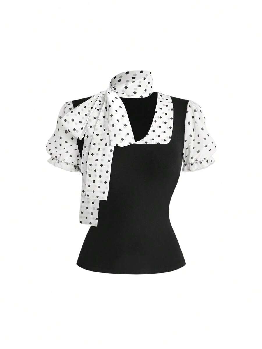 Women's black short puff sleeve graphic print t-shirt featuring a sweetheart neckline and knot detail.