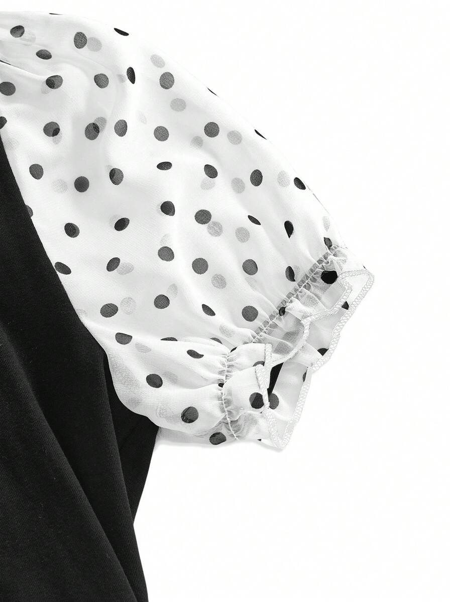 Women's black short puff sleeve graphic print t-shirt featuring a sweetheart neckline and knot detail.