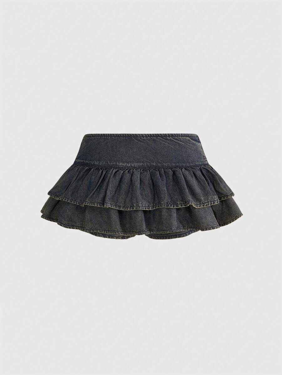 Y2K ultra low waist mini skirt with tiered layer detail, ruffle hem, zipper closure, straight silhouette, and fabric.