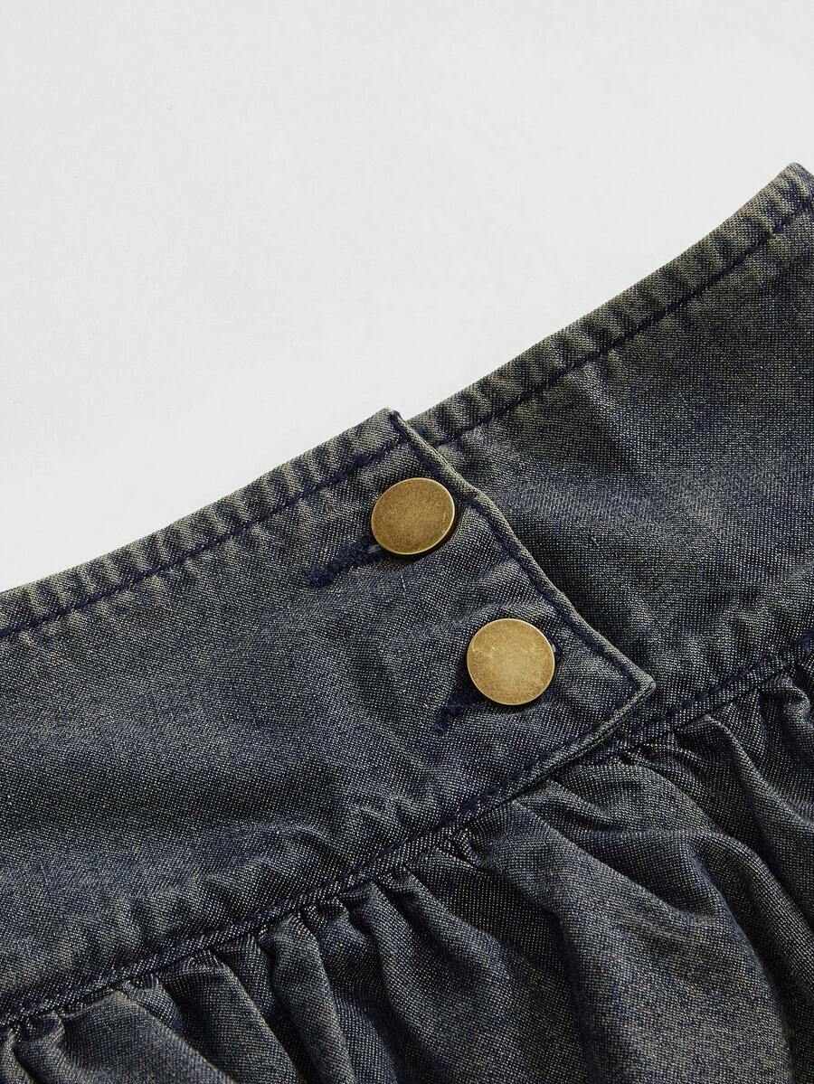 Y2K ultra low waist mini skirt with tiered layer detail, ruffle hem, zipper closure, straight silhouette, and fabric.