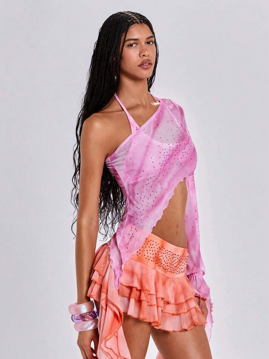 Women's one shoulder crop top featuring an asymmetrical long sleeve, colorful print, and sparkling rhinestone embellishments.