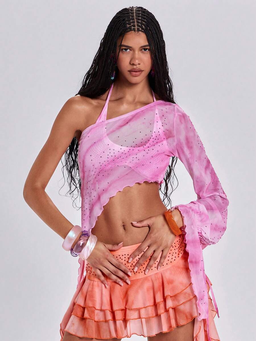 Women's one shoulder crop top featuring an asymmetrical long sleeve, colorful print, and sparkling rhinestone embellishments.