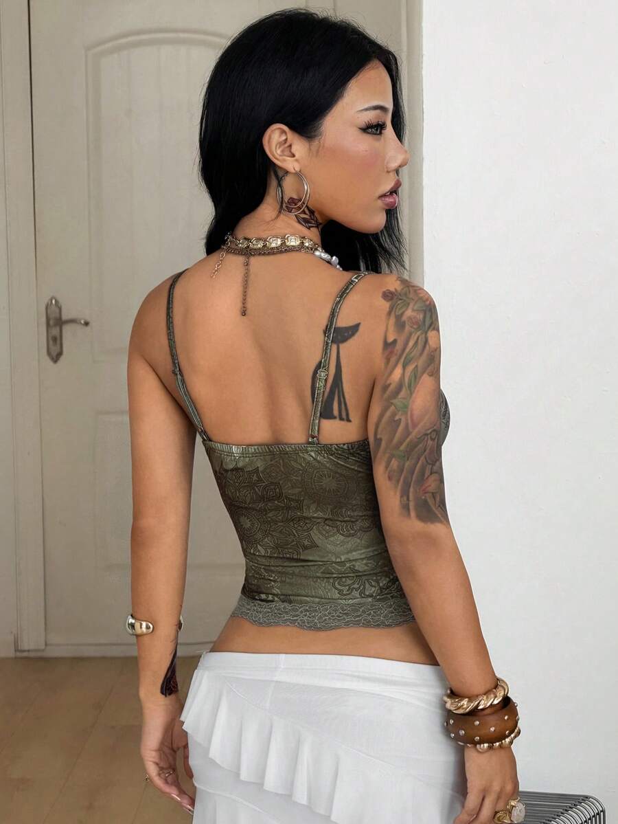 Slim fit cropped camisole top for women featuring contrast lace trim, ruched cup detailing, and delicate spaghetti straps.