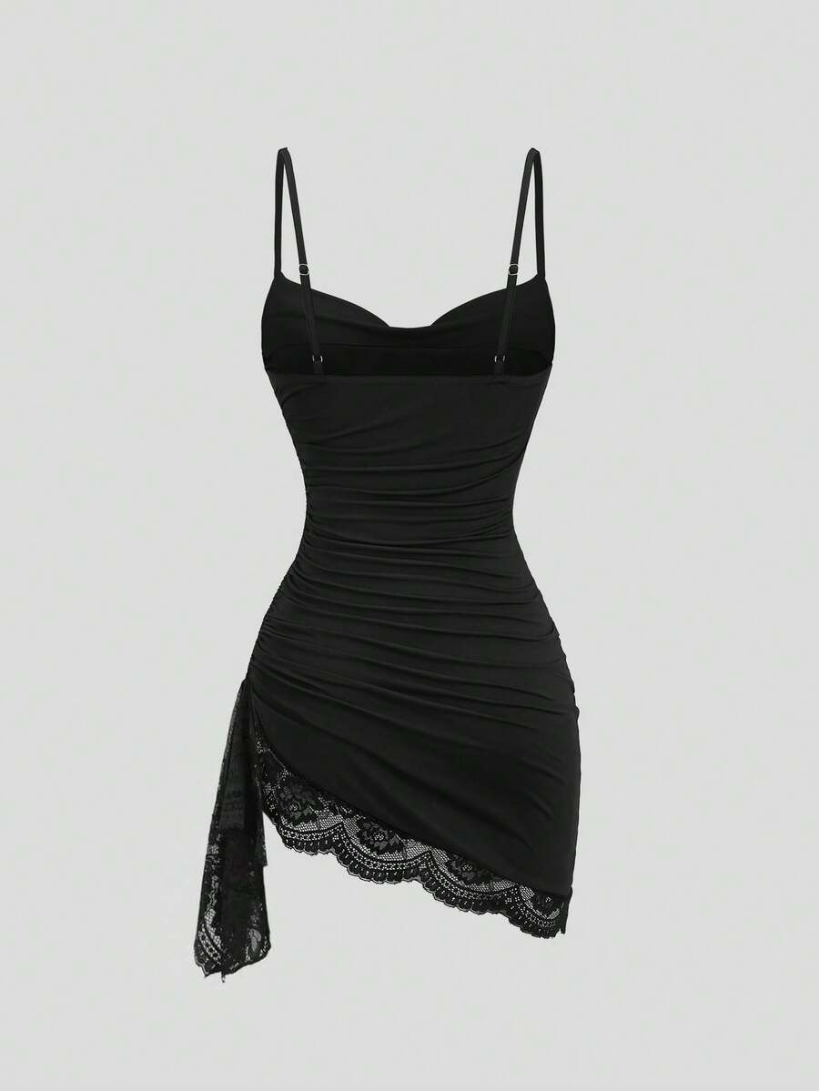 Women's short cami dress with cowl neck, spaghetti straps, contrast lace patchwork, pleated detail, and asymmetrical hem