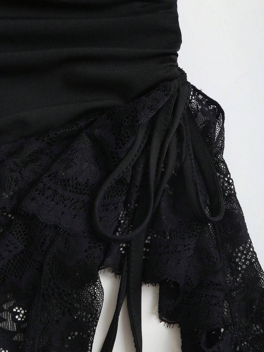Women's short cami dress with cowl neck, spaghetti straps, contrast lace patchwork, pleated detail, and asymmetrical hem