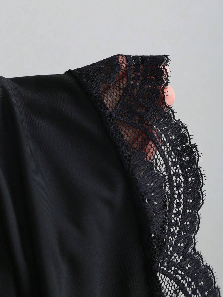 Women's short cami dress with cowl neck, spaghetti straps, contrast lace patchwork, pleated detail, and asymmetrical hem