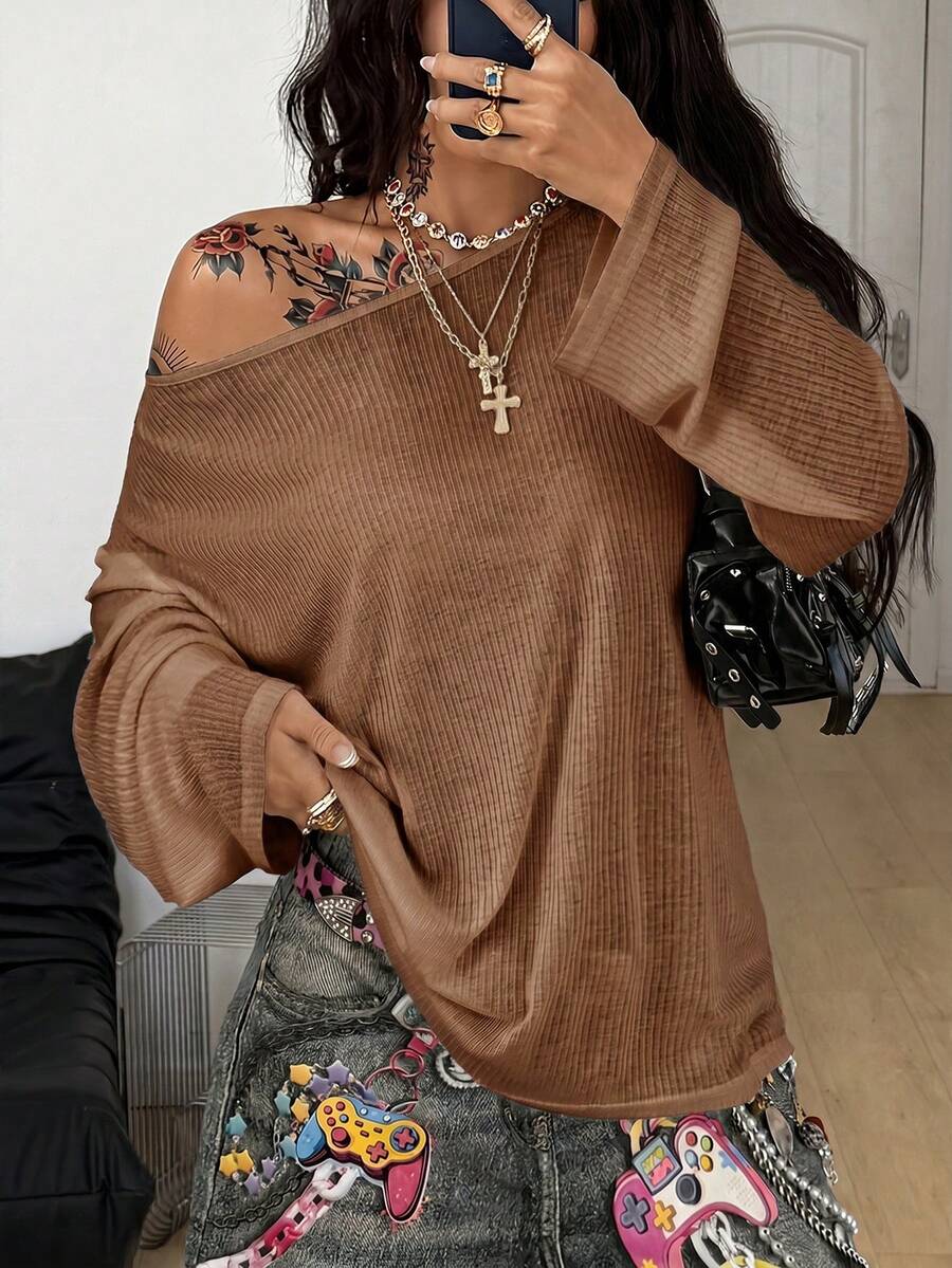 Women's off the shoulder long sleeve t-shirt featuring an asymmetrical neckline and loose fit in soft knitted fabric.