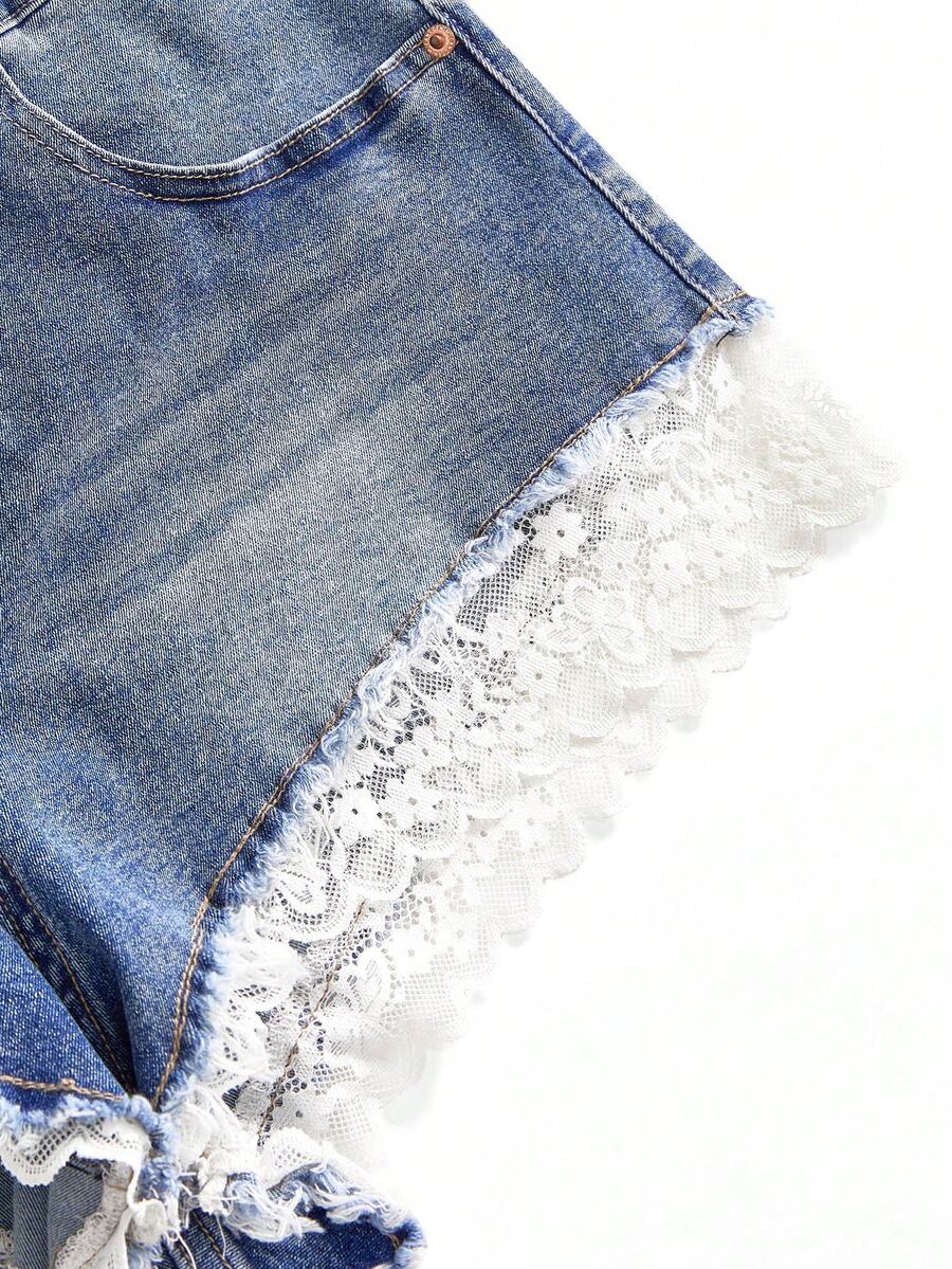 Front view of women's plus size skinny denim shorts featuring lace patchwork detailing, mid-rise waist, button zipper closure, and classic pockets.