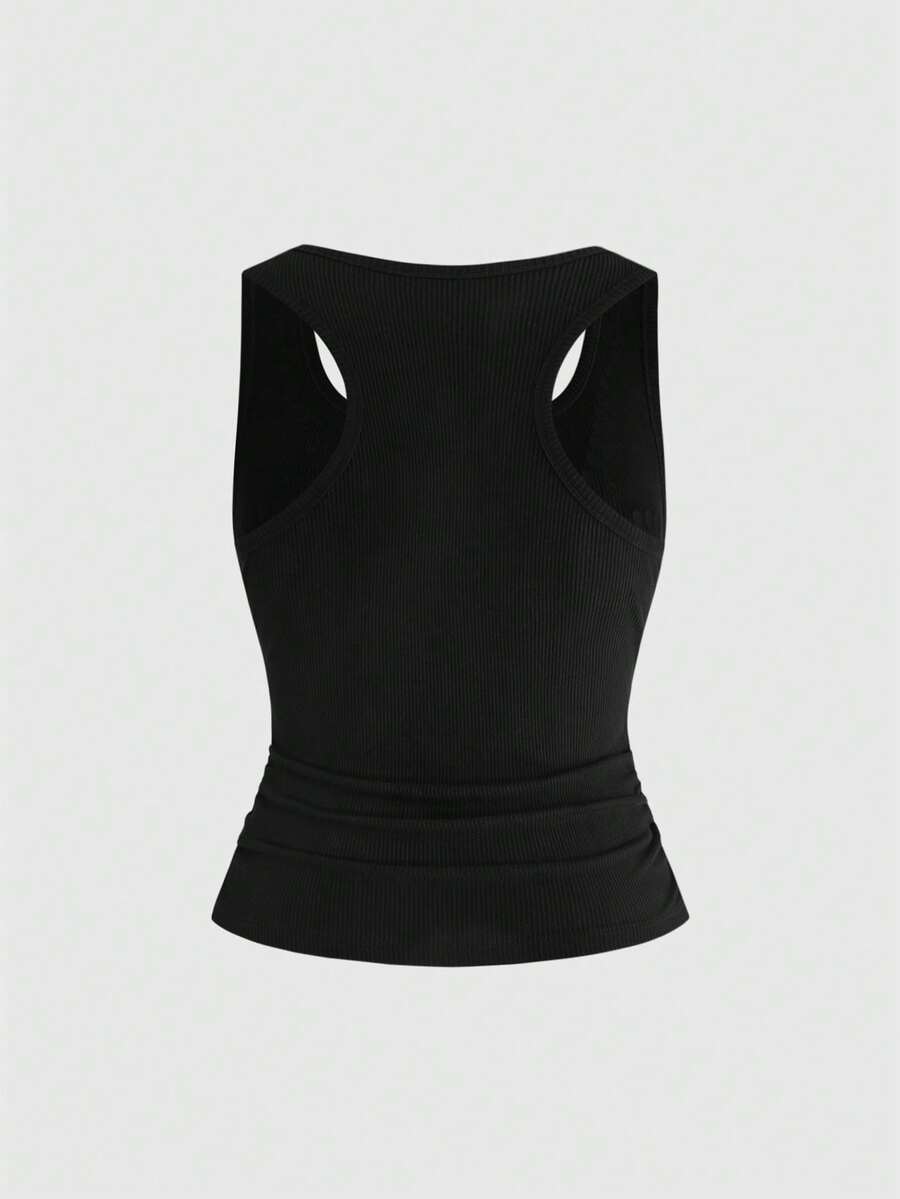 Black scoop neck slim fit tank top with exaggerated spider rhinestone detailing.