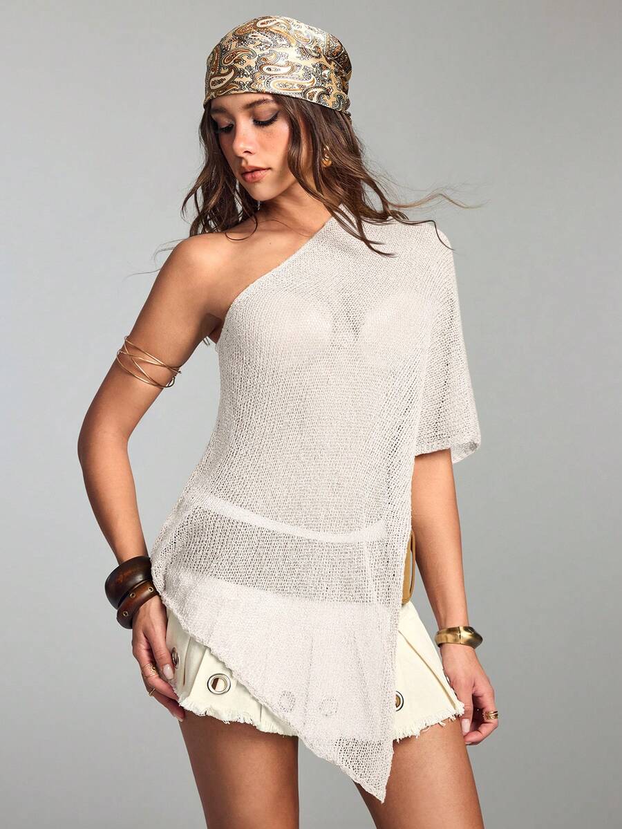 Women's casual hollow knit poncho top with boat neck, cloak sleeves, and asymmetrical hem