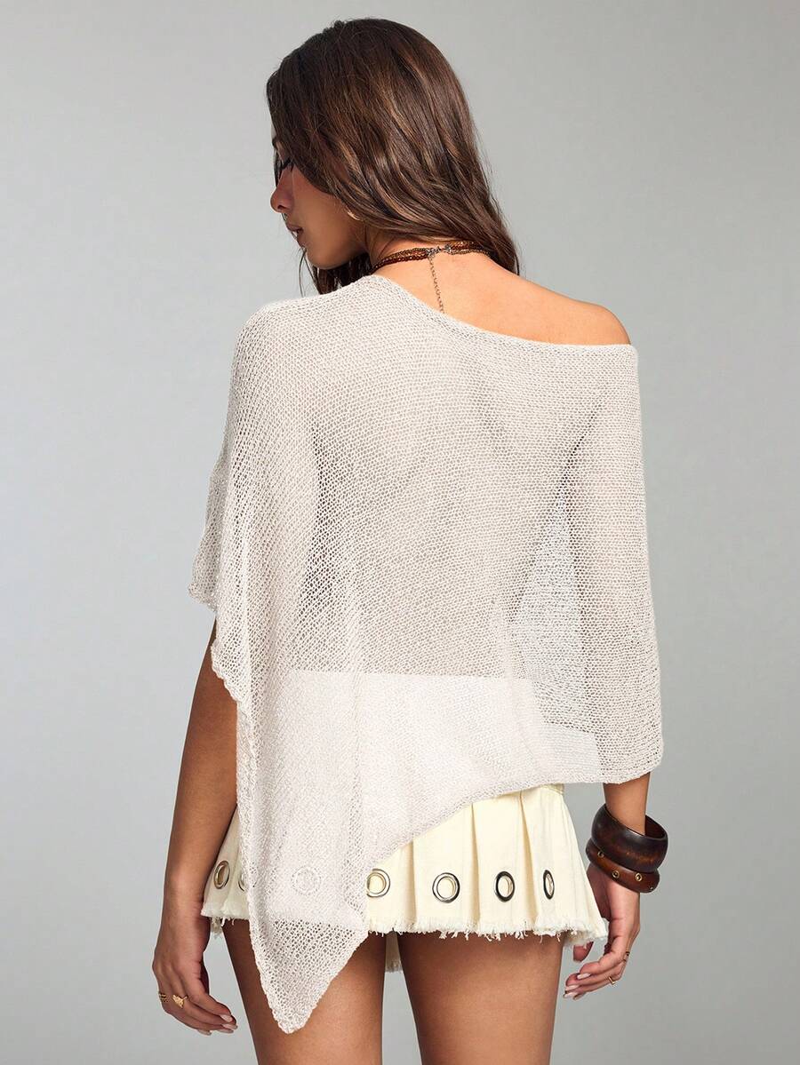 Women's casual hollow knit poncho top with boat neck, cloak sleeves, and asymmetrical hem