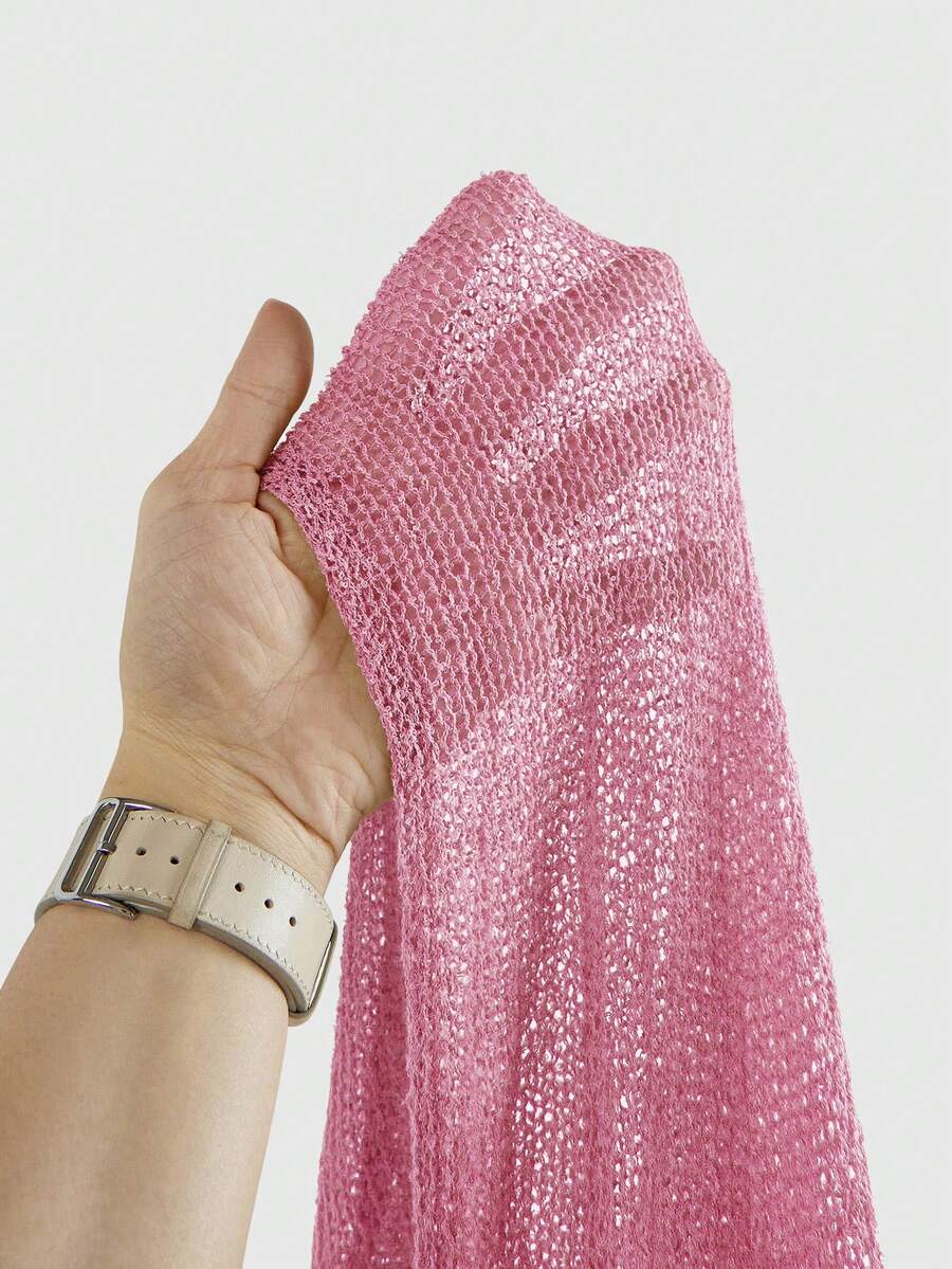 Women's casual hollow knit poncho top with boat neck, cloak sleeves, and asymmetrical hem