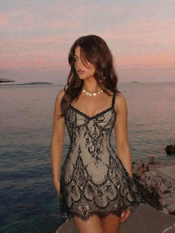 Women's short lace cami dress with spaghetti straps, contrast lace detailing, high waist, slim fit, and straight hem.