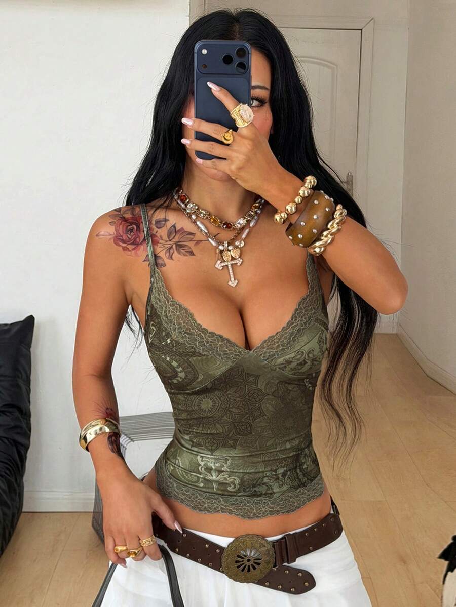 Slim fit cropped camisole top for women featuring contrast lace trim, ruched cup detailing, and delicate spaghetti straps.