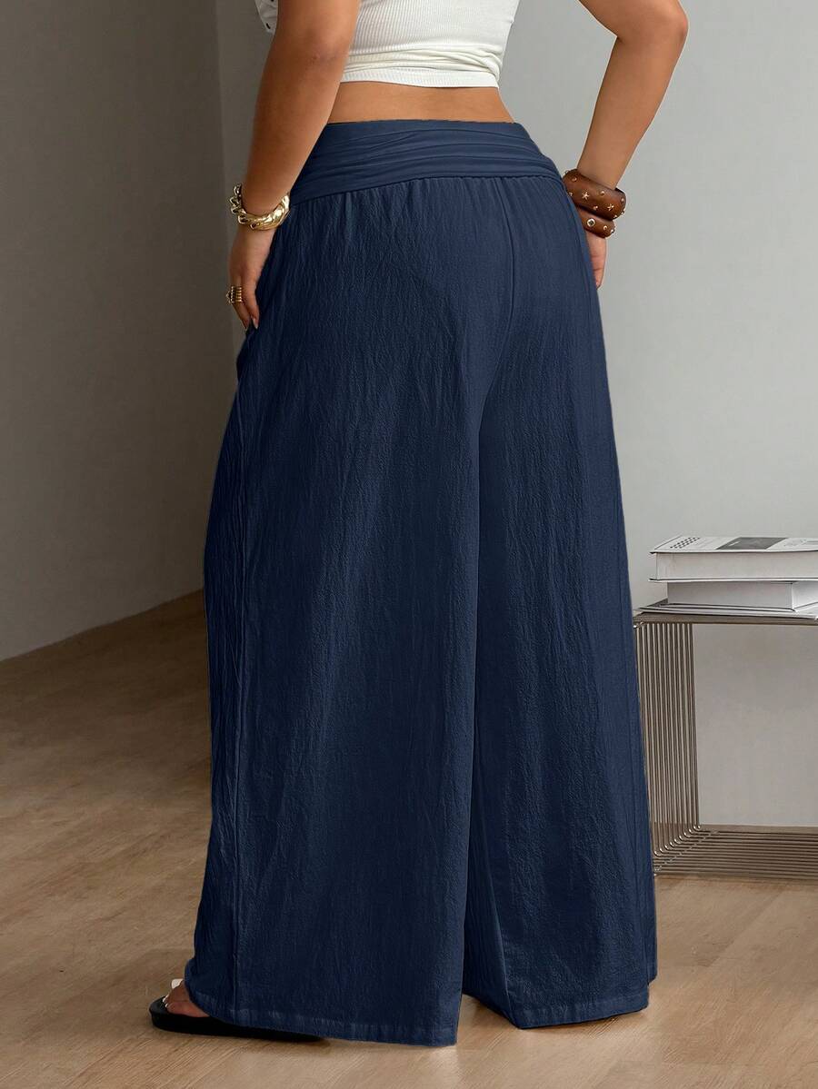 Women's plus size wide leg cotton pants featuring a relaxed loose fit and high waist design.