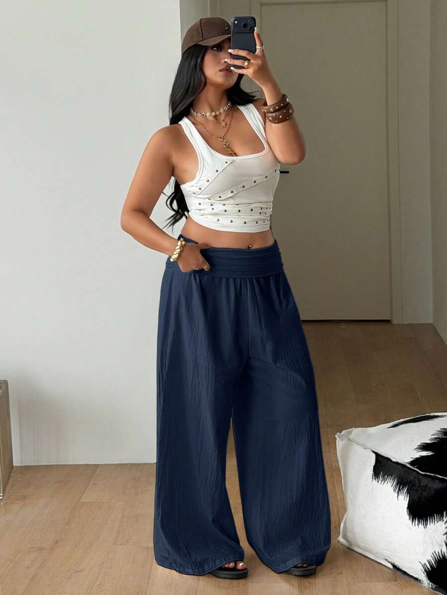 Women's plus size wide leg cotton pants featuring a relaxed loose fit and high waist design.
