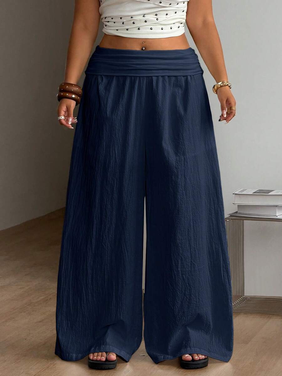 Women's plus size wide leg cotton pants featuring a relaxed loose fit and high waist design.