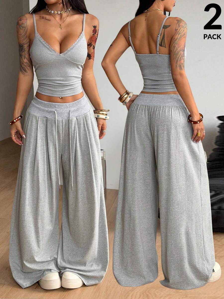 Women's two-piece grey loungewear set featuring a lace trim spaghetti strap camisole top with arm sleeves and wide-leg drawstring sweatpants.