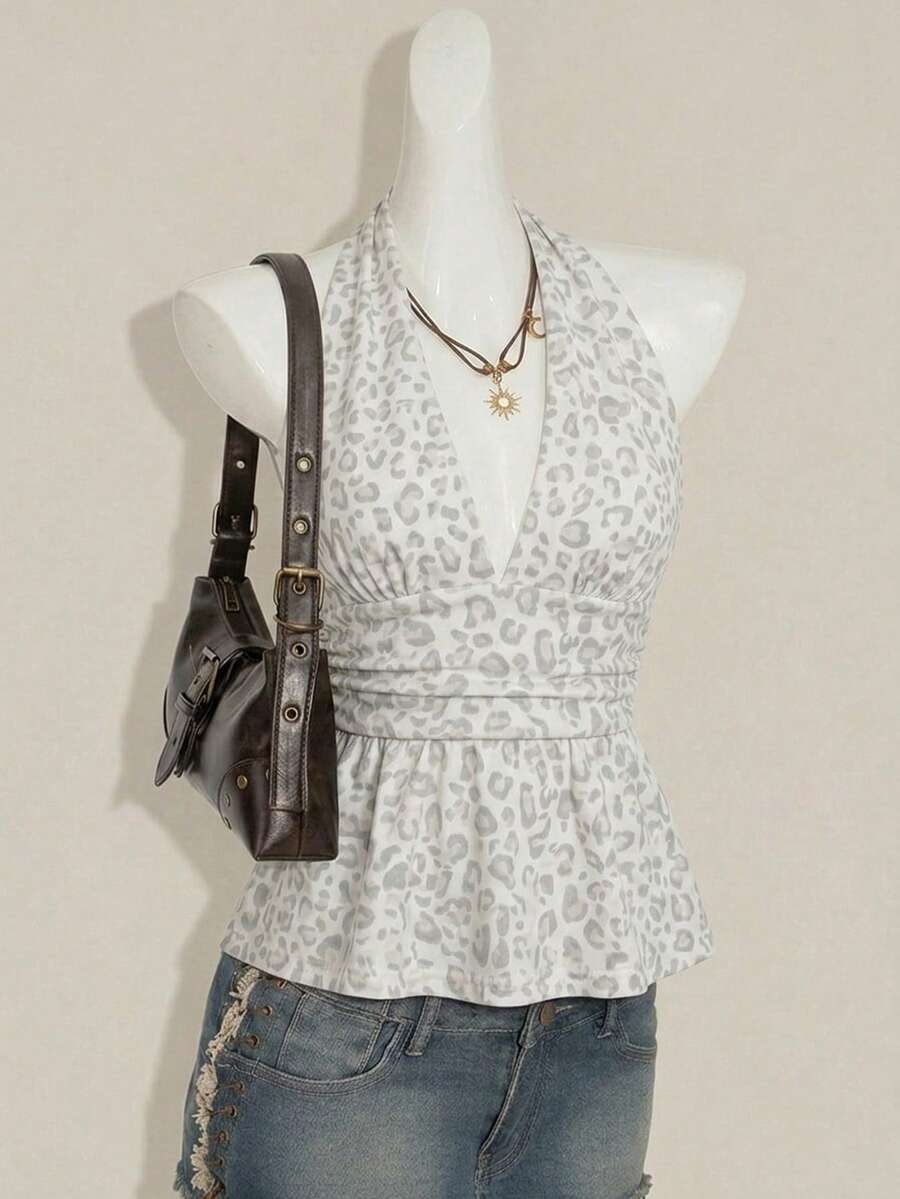 Women's backless halter babydoll tank top featuring a square neckline, slim fit silhouette, and a flared ruffle hem.