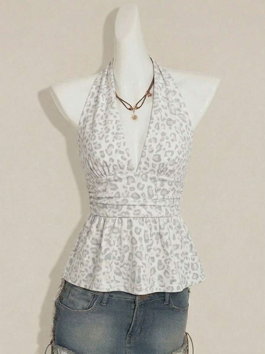 Women's backless halter babydoll tank top featuring a square neckline, slim fit silhouette, and a flared ruffle hem.