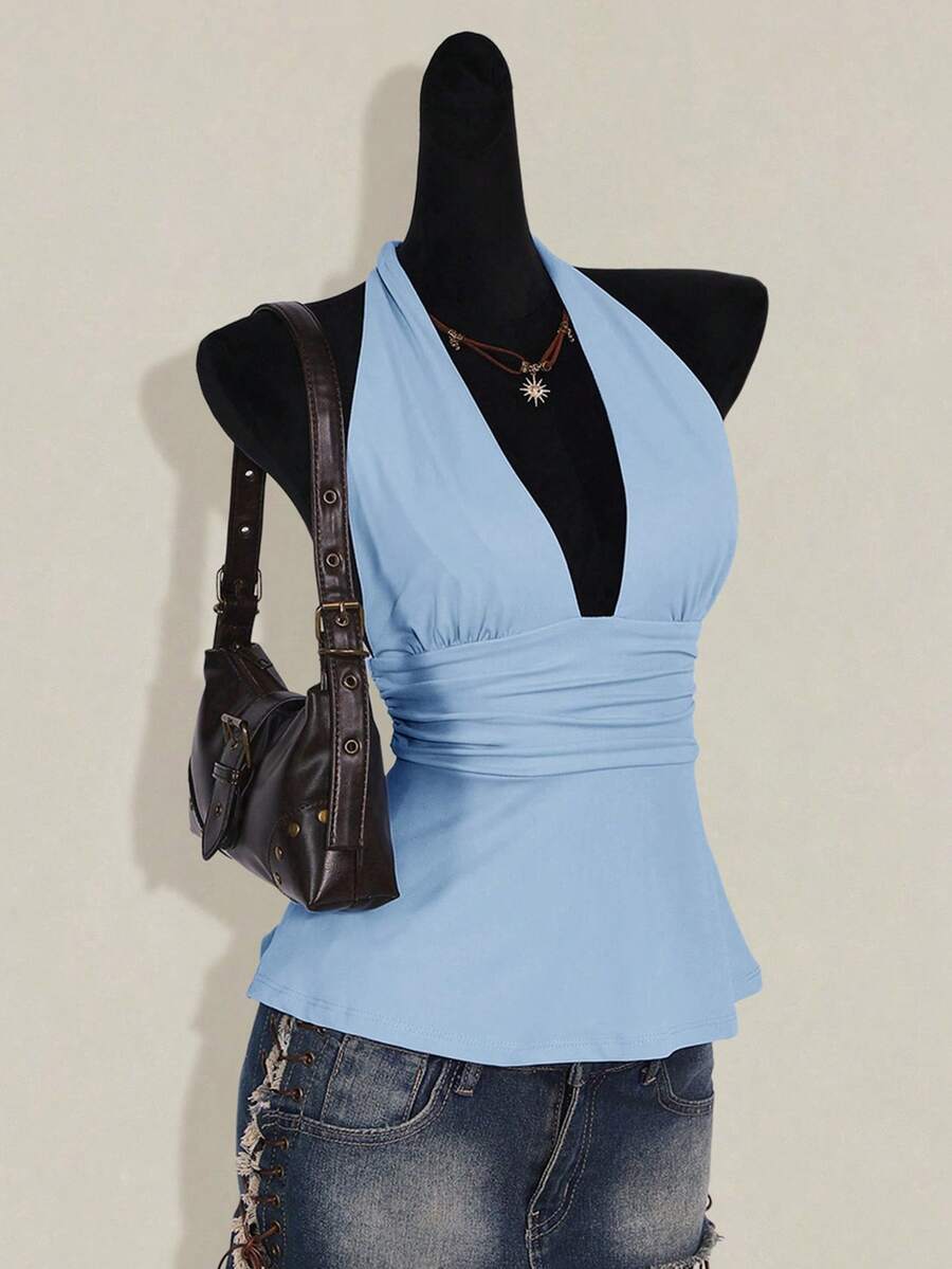 Women's backless halter babydoll tank top featuring a square neckline, slim fit silhouette, and a flared ruffle hem.