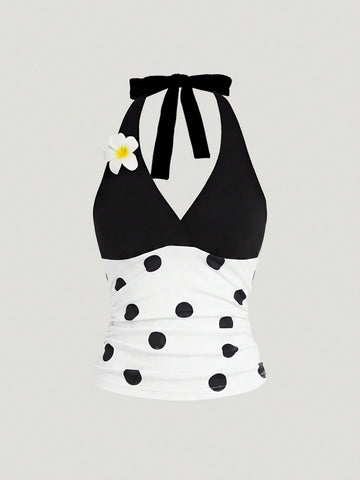 Women's black and white halter neck tank top with ladybug and daisy decor, geometric pattern, ruched front, knot detail, and backless design.