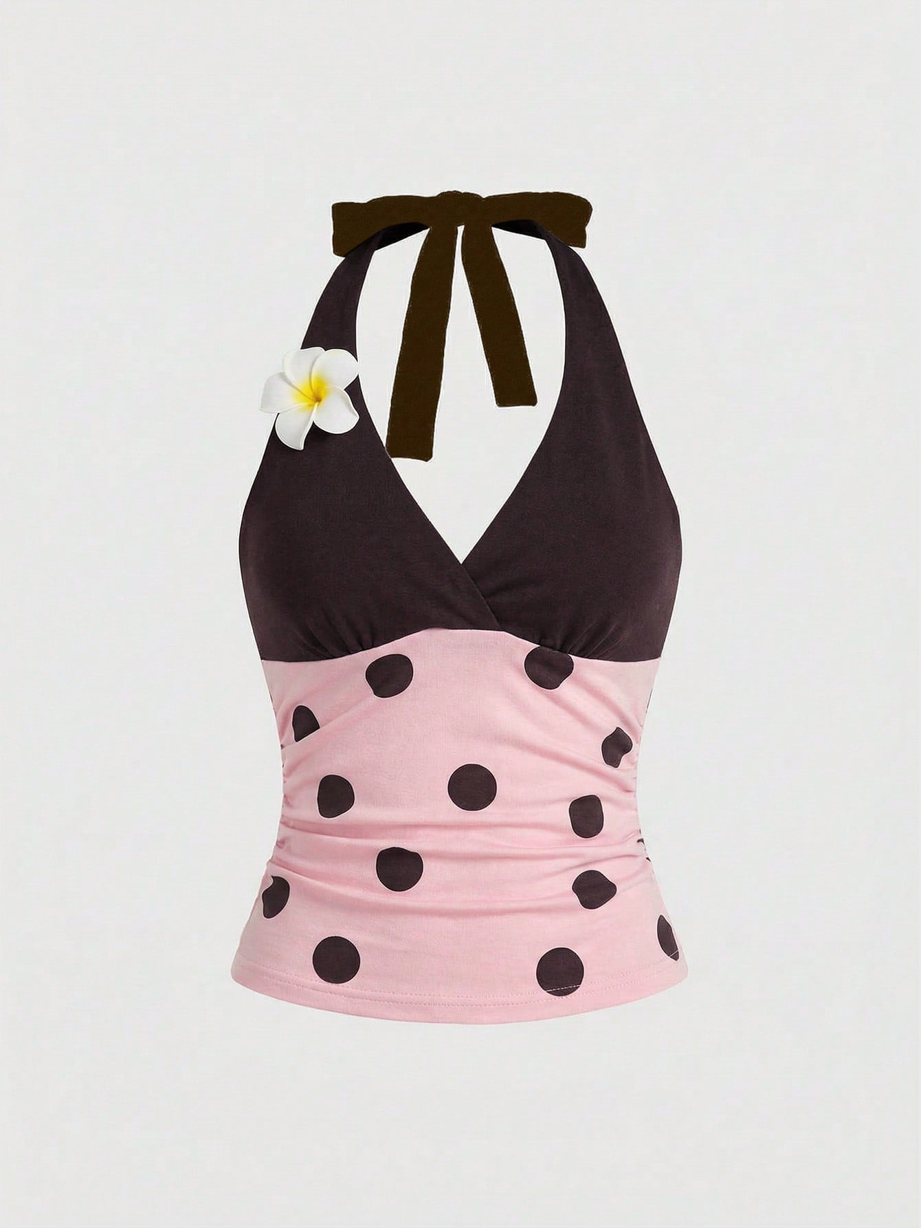 Women's black and white halter neck tank top with ladybug and daisy decor, geometric pattern, ruched front, knot detail, and backless design.