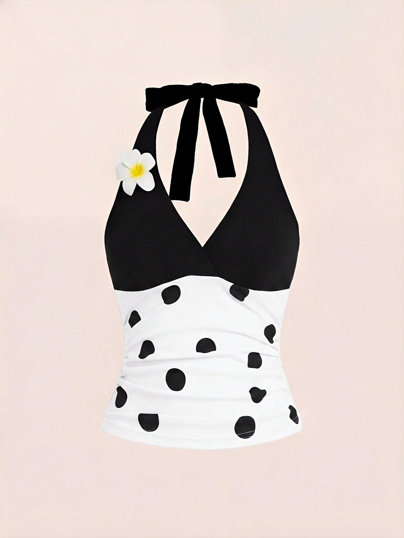 Women's black and white halter neck tank top with ladybug and daisy decor, geometric pattern, ruched front, knot detail, and backless design.