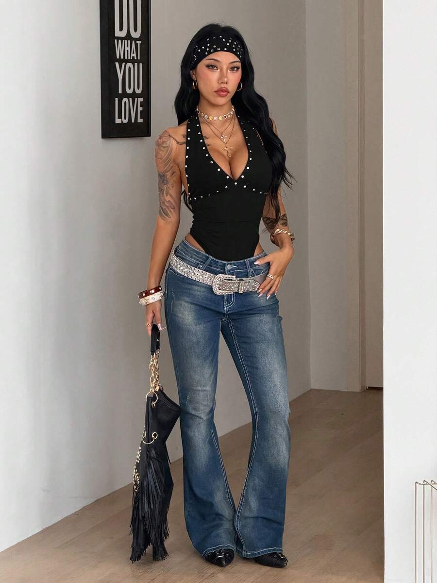 Women's black halter bodysuit featuring silver studded rivet details on a stretchy slim-fit sleeveless top.