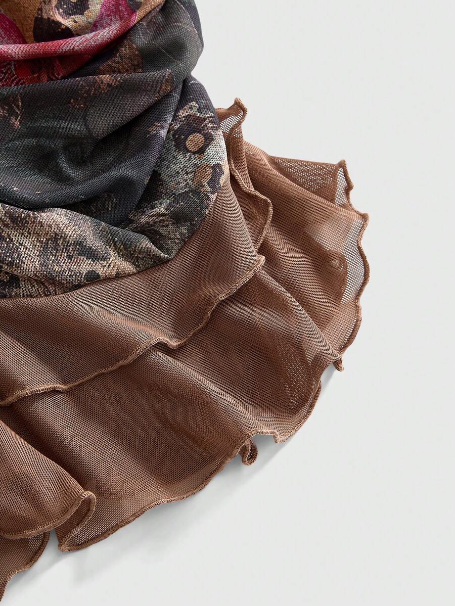 Women's brown two-piece set featuring a ruched camisole top with ruffle hem and asymmetrical neck alongside a plant print mini skirt.