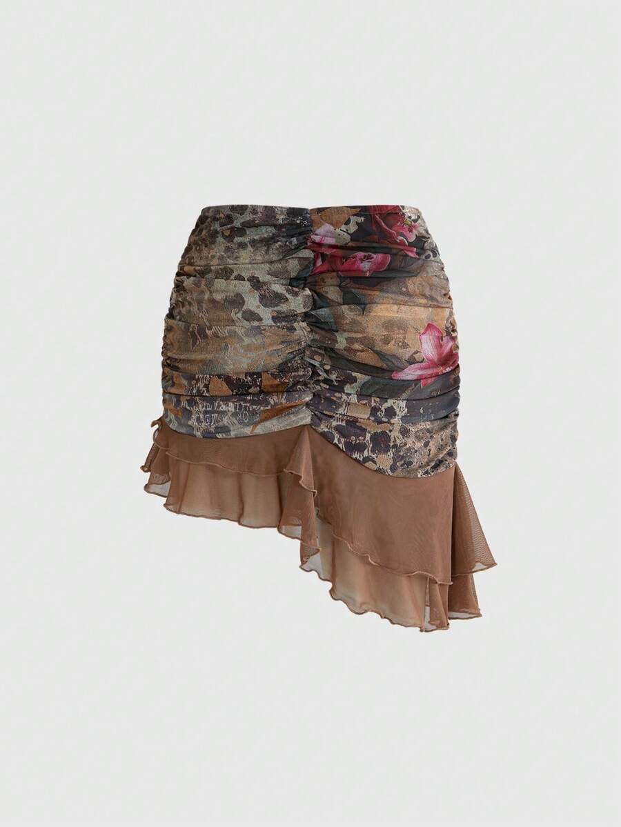 Women's brown two-piece set featuring a ruched camisole top with ruffle hem and asymmetrical neck alongside a plant print mini skirt.