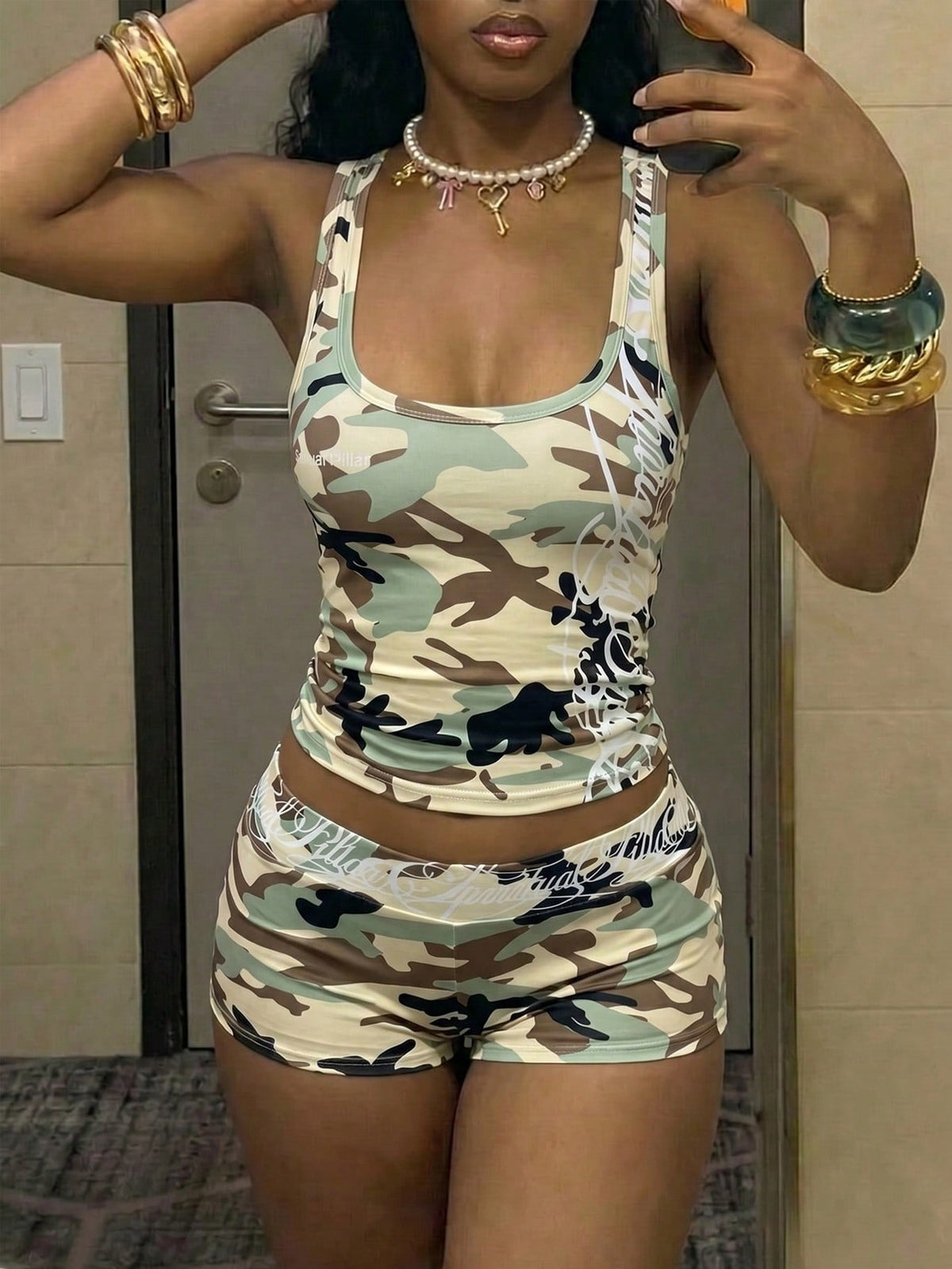 Women's Halloween print two-piece outfit with scoop neck camisole top and matching short biker track shorts in a slim fit